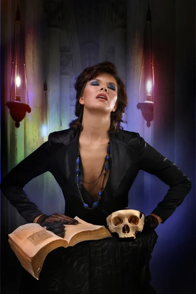Modern sexi witch casts a spell on the old background — Stock Photo, Image