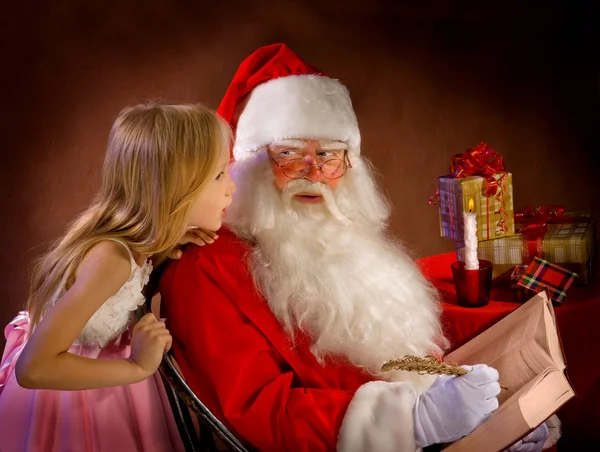 Little Girl Talking to Santa Clause While He Writes Magic Feathe — Stock Photo, Image