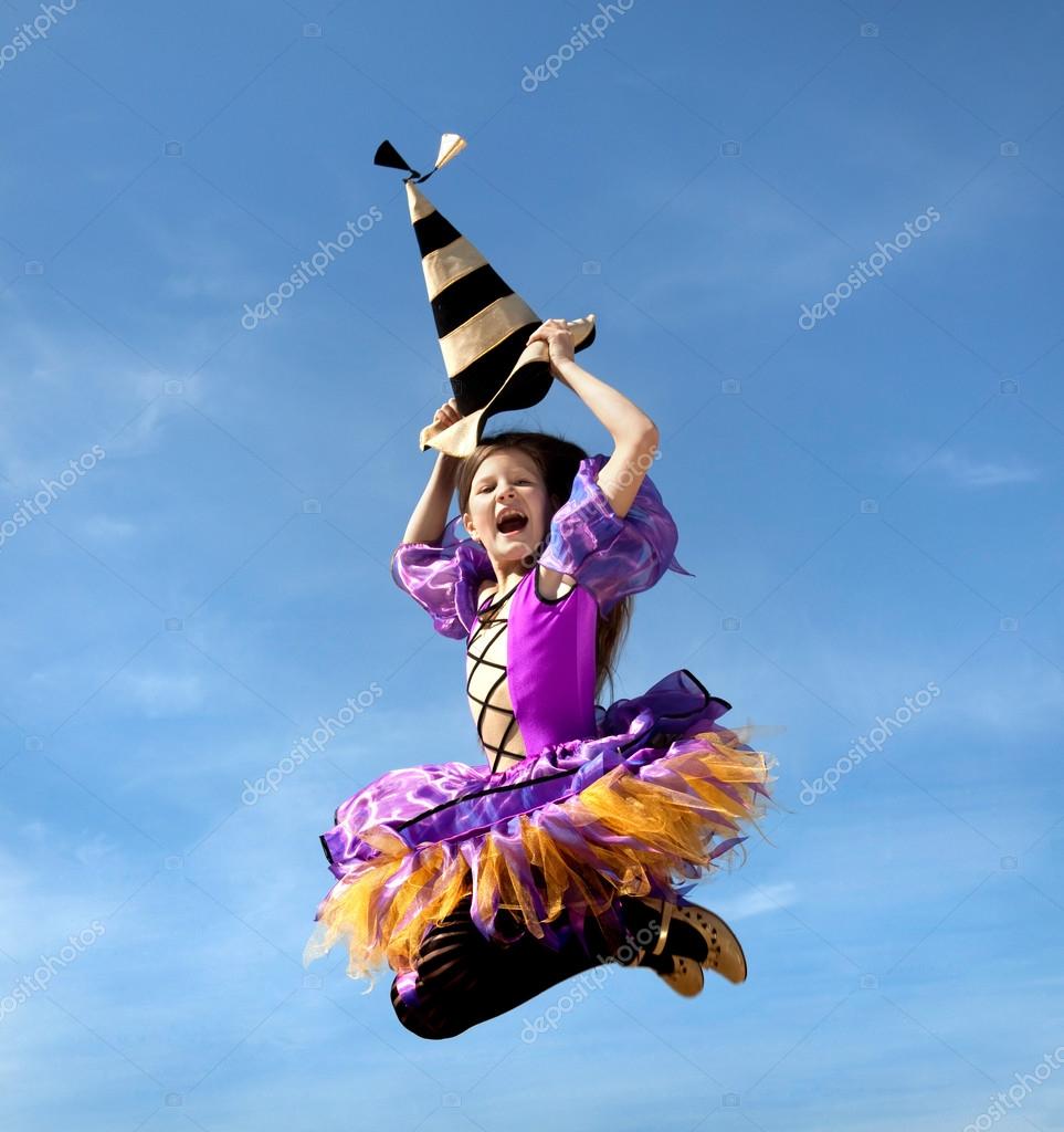 Happy Little Witch Jumping At The Blue Sky Stock Photo C Alexandernovikov Happy Little Witch Jumping At The Blue Sky Stock Photo C Alexandernovikov