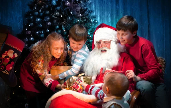 Classic Santa sitting with Happy Children — Stock Photo, Image