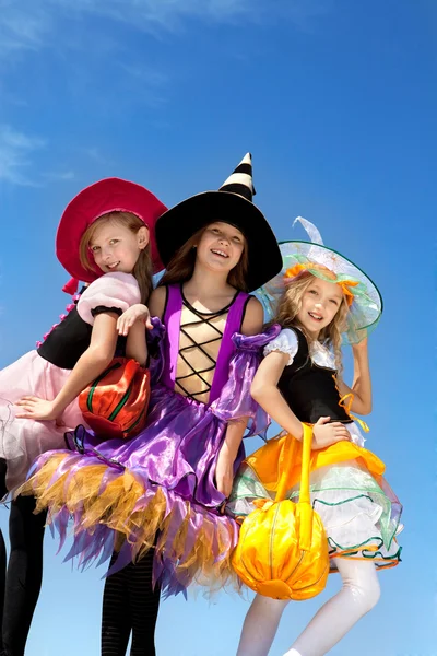 Three Cute Little Witches Standing with Bags — Stock Photo, Image