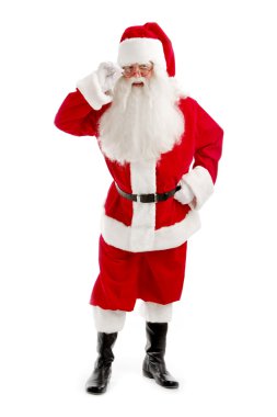 Santa - Claus görünüyor dikkatle aracılığıyla doğrudan onun gözlük,
