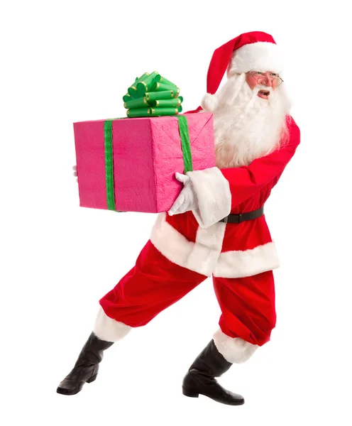 Santa celebración regalo de Navidad en sus manos en un backgrou blanco — Foto de Stock