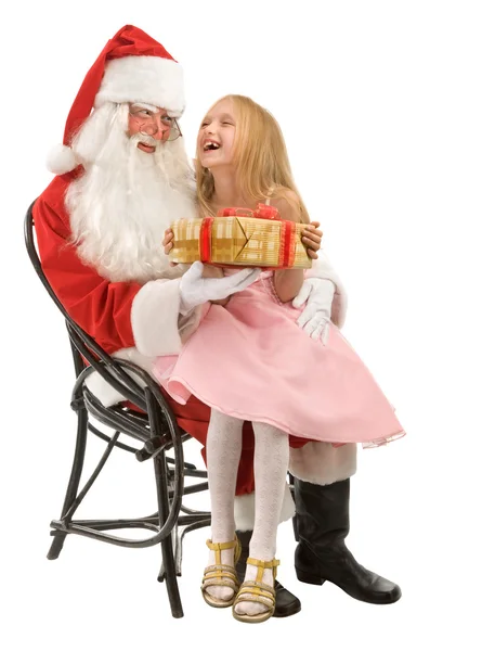 Papai Noel dá um presente para uma menina — Fotografia de Stock