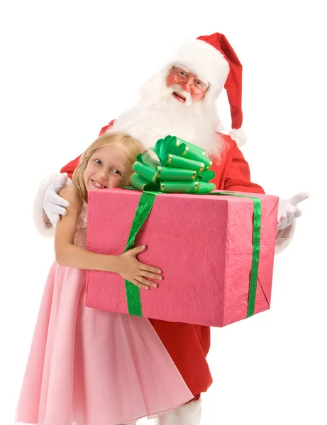 Feliz niña abraza a Santa con gran regalo de Navidad en el W — Foto de Stock