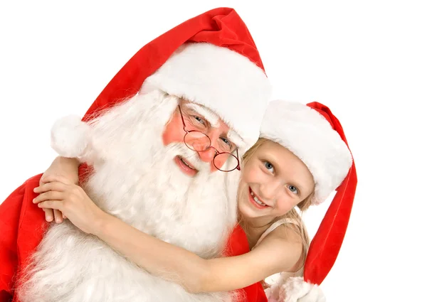 Feliz niña abraza a Santa en el fondo blanco —  Fotos de Stock