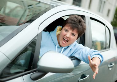 Angry Woman Driver Shouts clipart