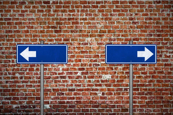 directional sign on brick wall