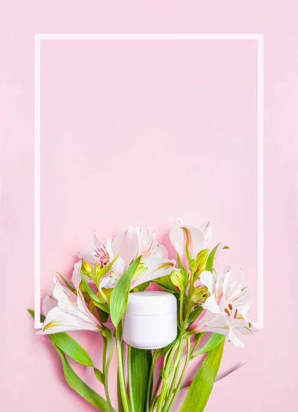 Jar of cream with flowers on pastel pink background. Cosmetics background. Banner for stories. Place for text. Space for text. Cosmetology price page. Modern banner. White frame background. High quality photo