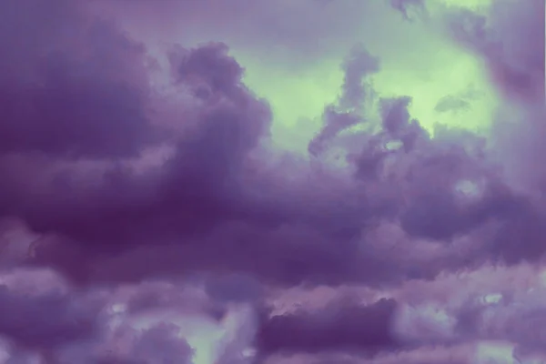 Abstract background of the clouds colored in purple.