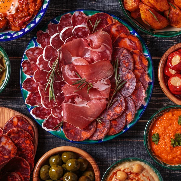 Typical spanish tapas concept, rustic style, top view. — Stock Photo