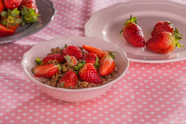 Chocolate cereal with milk and strawberries