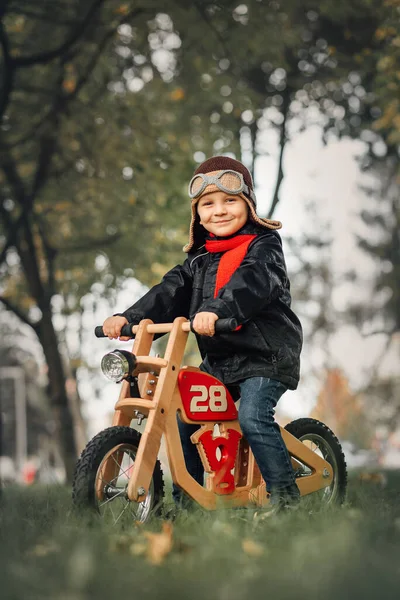 Small Child Sits Balance Bike Outerwear Stock Picture