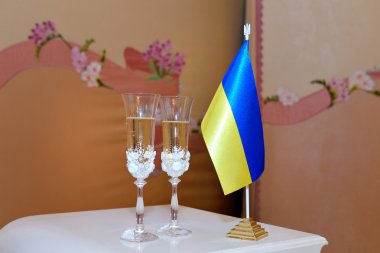 glasses with champagne and flag of Ukraine clipart