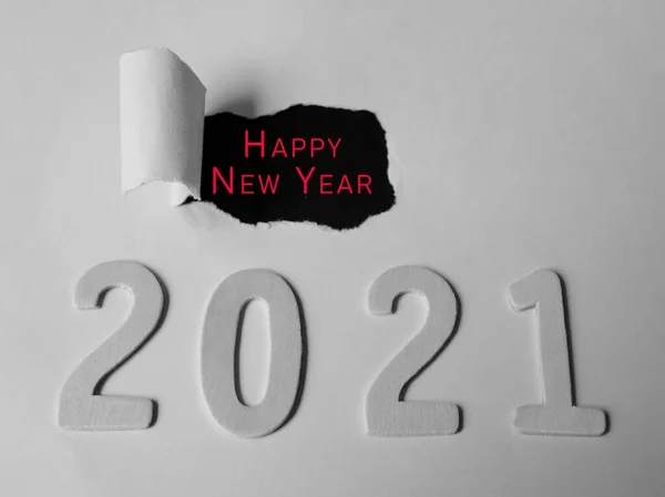 Happy new year text on torn paper with Year 2021 background — Stock Photo, Image