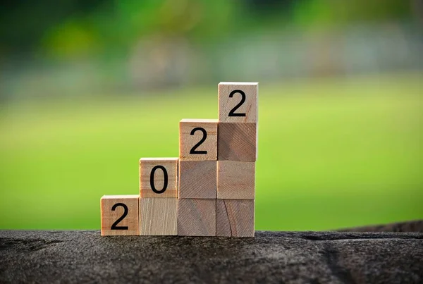 2022 number on wooden block with blurred background. 2022 new year concept