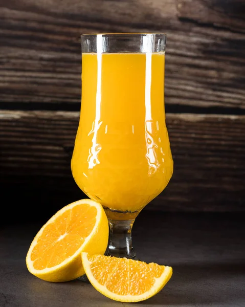 Orange juice cup with oranges cuts