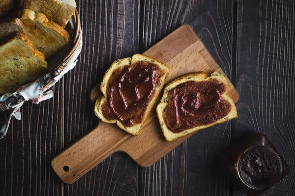 Overview of toasted bread with strawberri marmalade