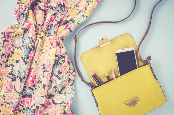 Overhead shot of female dress and bag