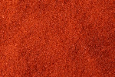 Kırmızı biber tozu dokusu. Kopyalama alanı olan bir arkaplan. Kapatın. Üst görünüm