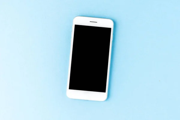 Smartphone Sobre Fondo Azul Con Copyspace — Foto de Stock