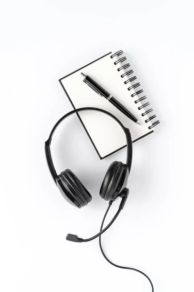 Helpdesk Headset Notebook Pen White Desktop Call Center Concept Top — Stock Photo, Image