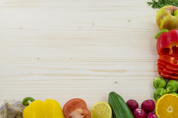 Frame of vegetables on wooden table. Background — Stock Photo, Image