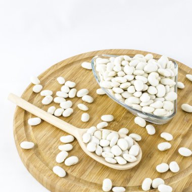 Fasulye seads ahşap tahta üzerinde. Sağlıklı vejetaryen yemek.