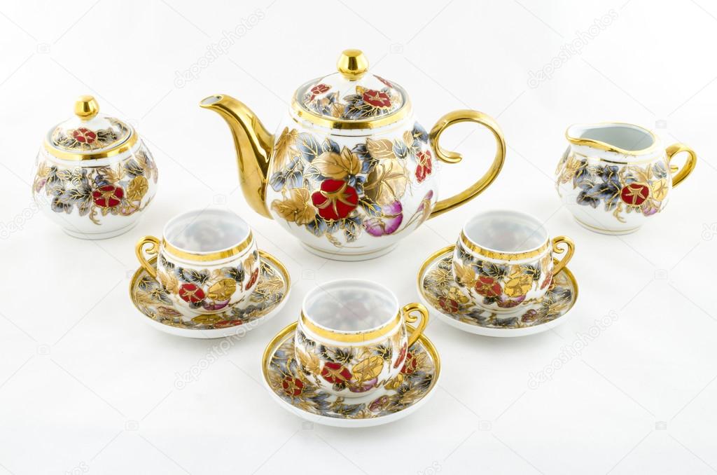 Antique porcelain coffee and tea set with flower motif