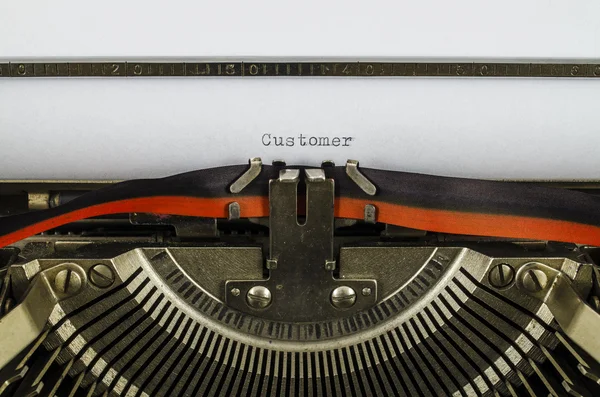 Klant woord gedrukt op een oude schrijfmachine — Stockfoto