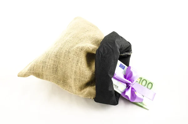 Money with pink bow in jute bag — Stock Photo, Image