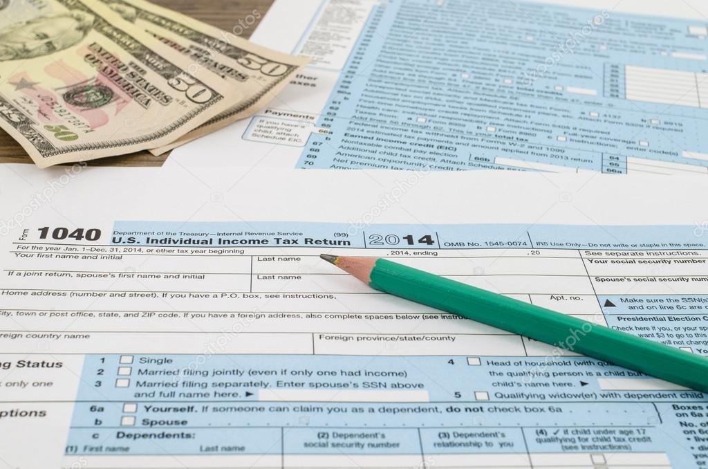 U.S. individual income tax return form 1040 with pencil