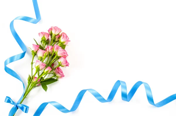 Empty white background with colorful flowers and blue ribbon — Stock Photo, Image