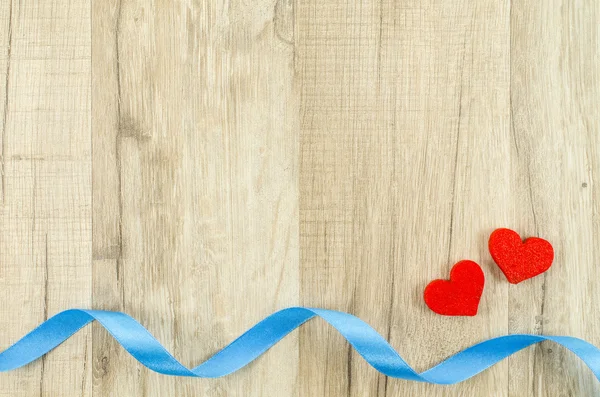 Heart and ribbon on wooden background — Stock Photo, Image