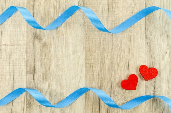 Heart and ribbon on wooden background — Stock Photo, Image