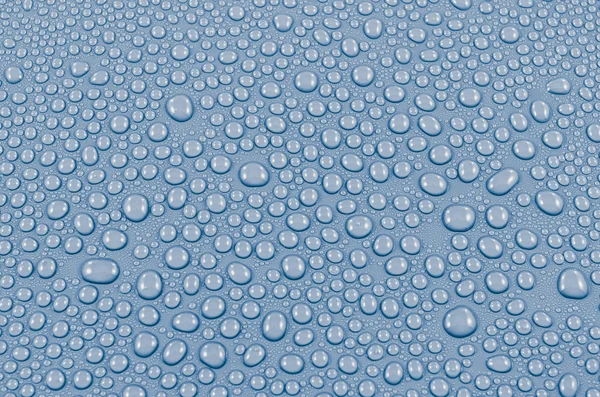 Acqua blu gocce di sfondo o consistenza. Primo piano — Foto Stock