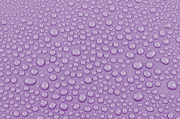 Krople wody purpurowe tło lub tekstury. Szczelnie-do góry — Zdjęcie stockowe