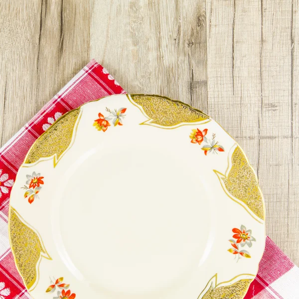 Plate on wooden table — Stock Photo, Image