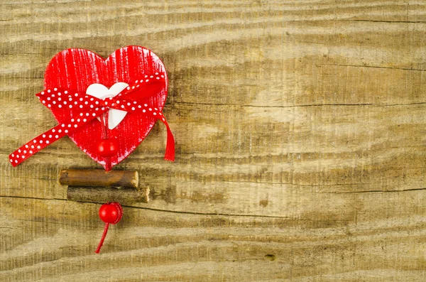 Red heart on empty wooden table — Stock Photo, Image