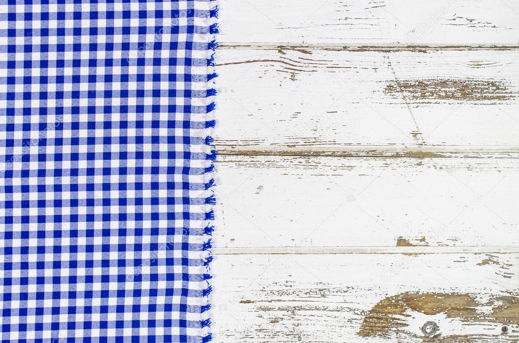 Blue tablecloth over wooden table