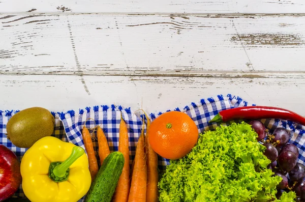 Frame of fresh fruits and vegetables on wooden table — Stock Photo, Image