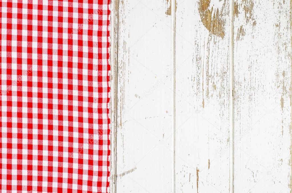 Red tablecloth over wooden table