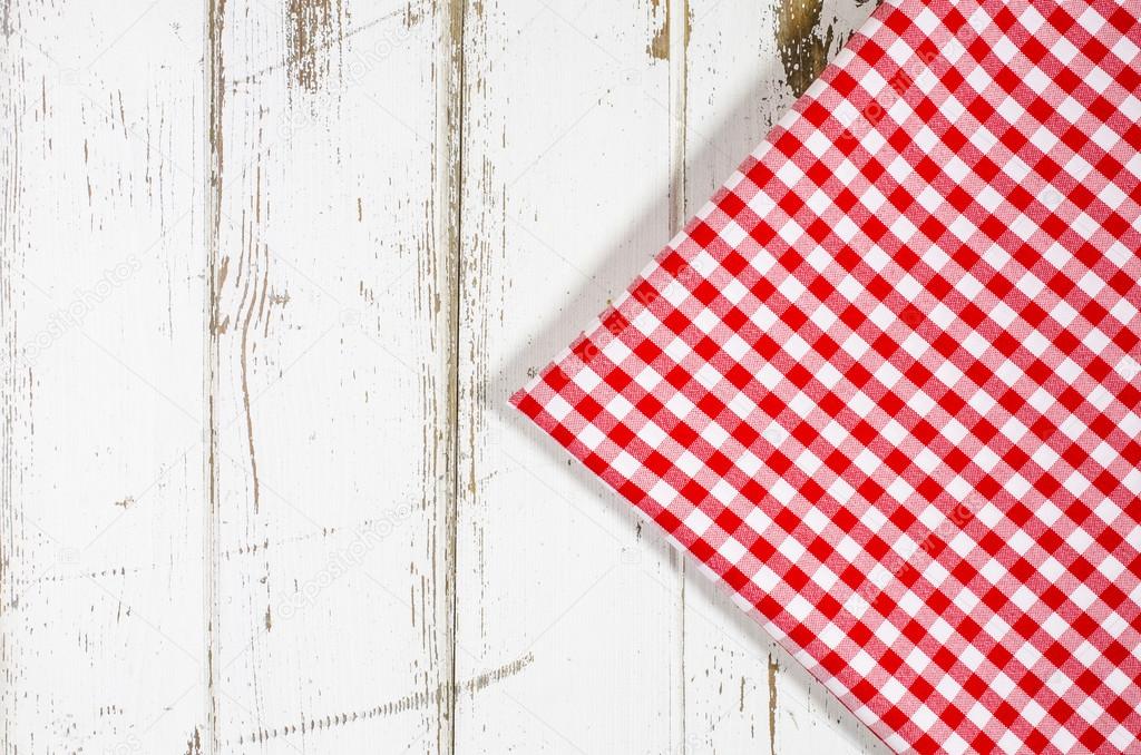 Red tablecloth over wooden table