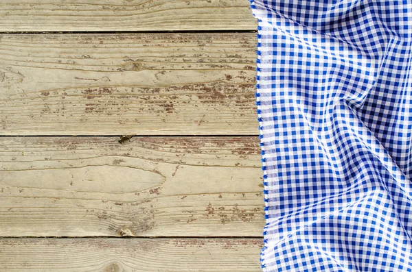 Niebieski składany obrus na stół drewniany — Zdjęcie stockowe