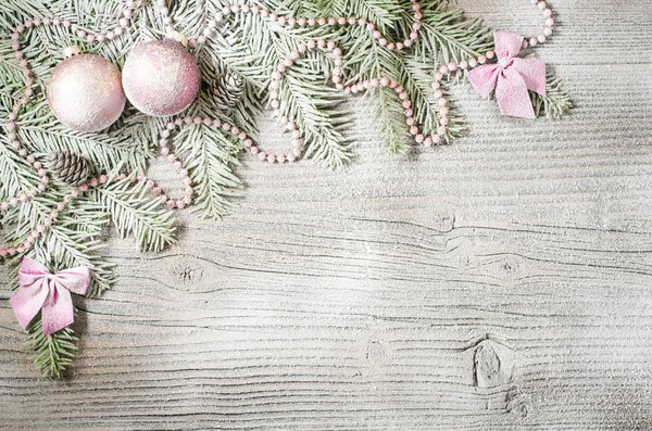 Christmas tree with decoration over old wooden background — Stock Photo, Image