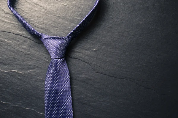 Elegant tie on dark background — Stock Photo, Image