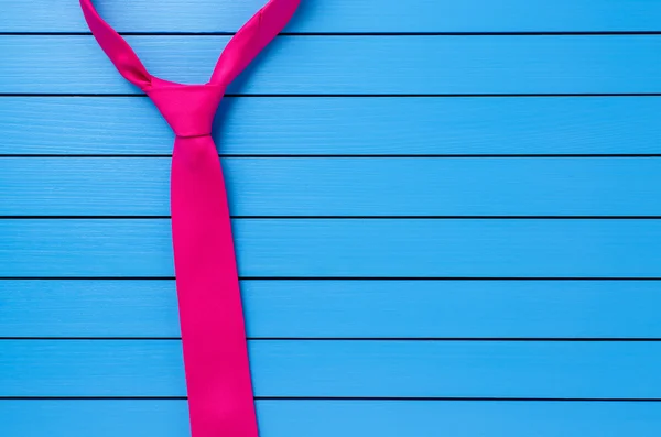 Pink tie on wooden background — Stock Photo, Image