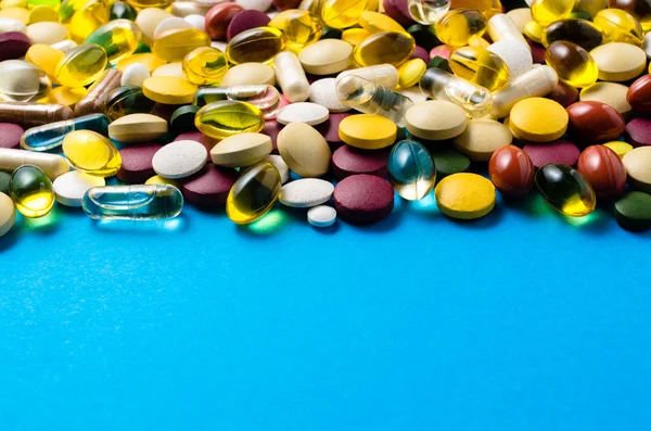 Pills on blue background — Stock Photo, Image