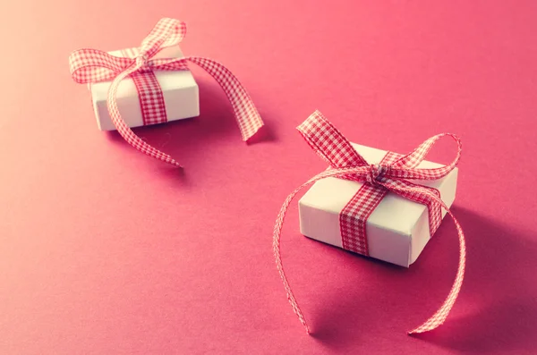 Gift boxes on red background — Stock Photo, Image