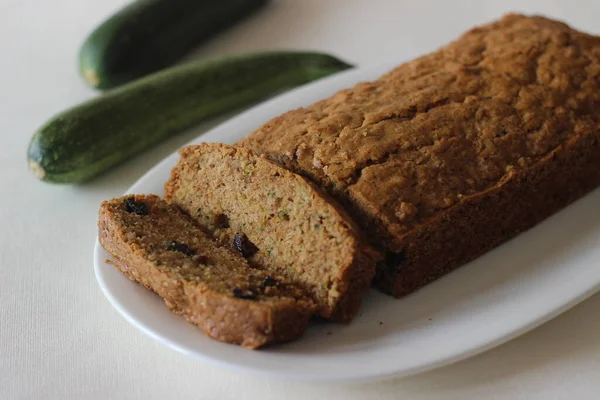 Zucchini raisin bread. Its a soft and moist quick bread made of shredded Zucchini with raisins, cinnamon and a dash of nutmeg added for flavour